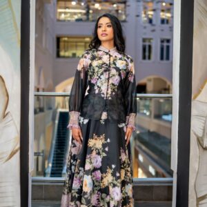 This exquisite black vintage floral skirt and blouse set is a masterpiece of wearable art. Crafted in ultra-light linen blend fabric with a heritage-inspired print in soft blues, corals, and sage, it features delicate pearl button detailing, bishop sleeves with ruched cuffs, and a gracefully flared skirt that moves with ethereal beauty.  Ideal for weddings, special celebrations, or simply making a statement with elegance.