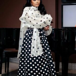 Polka Dot Elegance Set Playful sophistication meets timeless femininity. This two-piece polka dot ensemble features sheer organza blouse with bold black polka dots.Dramatic statement sleeves with soft volume & oversized bow-tie neckline for a luxe, couture feel. A-line midi skirt in contrasting polka dots for a classic silhouette Perfect for luncheons, high teas, celebrations, or any moment you want to look effortlessly refined. A modern twist on a timeless classic.